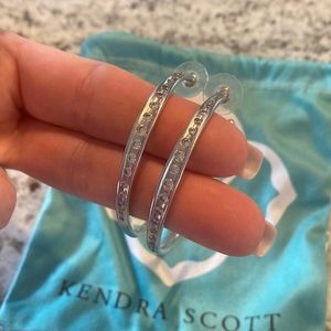 Set of Kendra Scott silver hoops with stones. Don’t know the name. About 2”.